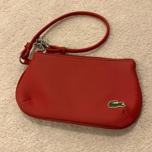 Red Lacoste wristlet